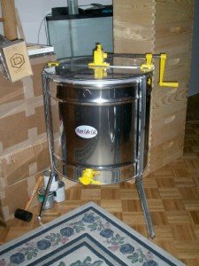 The extractor sitting happy inside next to my stacks of bee equipment. The extractor sitting happy inside next to my stacks of bee equipment.